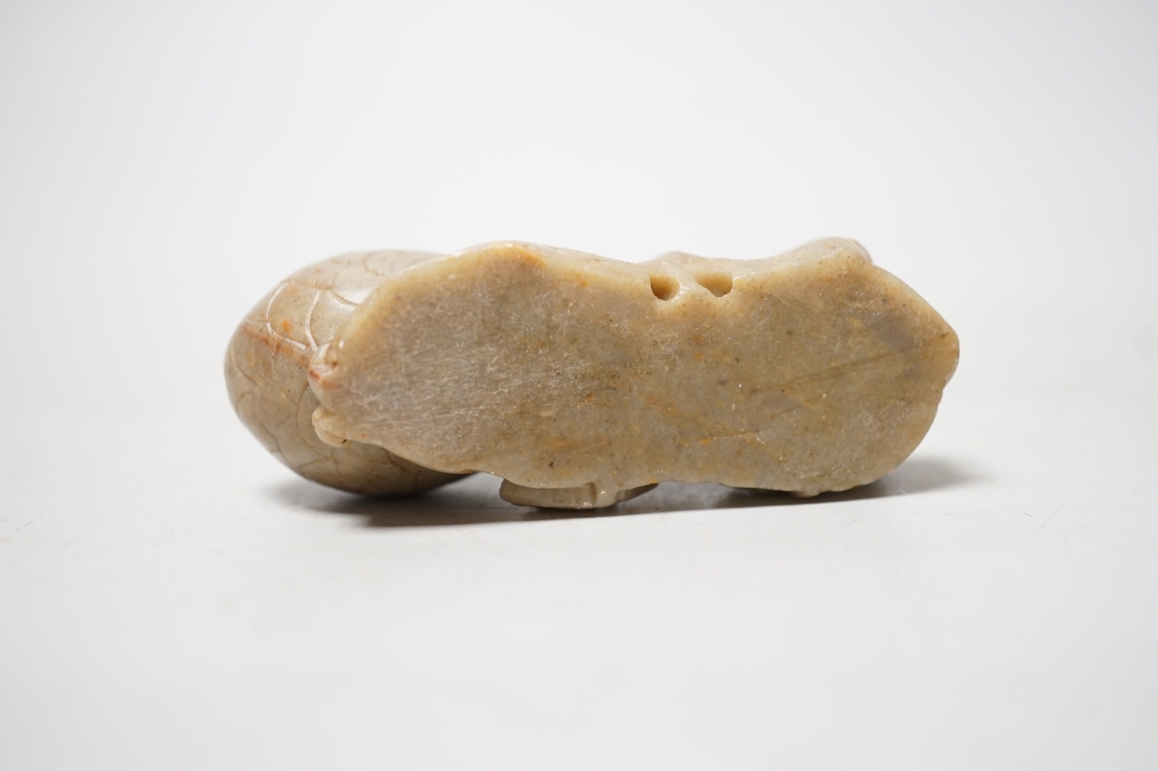 A Chinese carved soapstone carving of a squirrel and pine cone 8.5cm